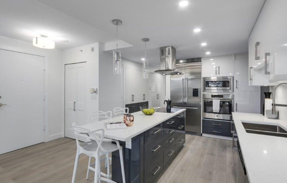 Bright custom kitchen with island seating and wood cabinetry
