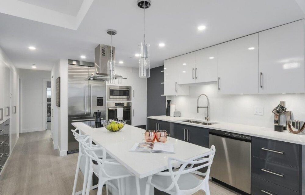 Modern kitchen with dark wood cabinetry and stone countertops