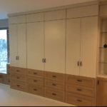 wall bed and cabinets with shaker doors and glass shelves