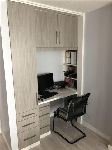 Compact home office nook with computer setup.