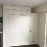 white queen murphy wall bed with table and side cabinets